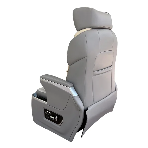 Rear view of aftermarket luxury car seats showing premium grey leather upholstery and a built-in backrest storage pocket.