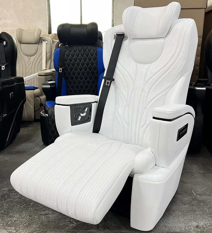 Close-up of an alphard seat featuring a power-adjustable leg rest in white leather, providing ergonomic support for VIP passengers.