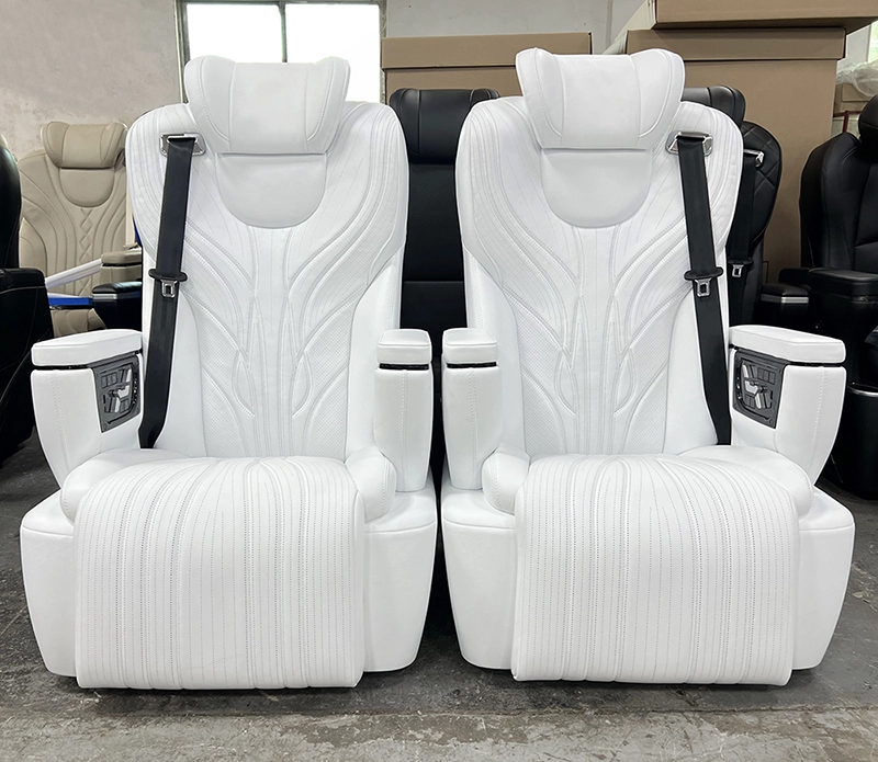A pair of white alphard seats for luxury van interior conversion, featuring ergonomic cocoon-style backrests and integrated seatbelts.
