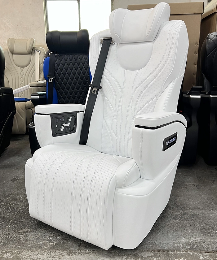 Side view of an alphard seat showing the premium physical button controller for electric recline, leg rest, and memory functions.