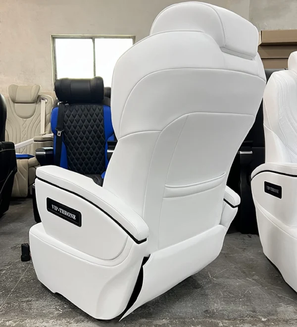 The back view of a white alphard seat featuring a sleek ergonomic design and a VIP-THRONE signature plate for luxury van conversions.