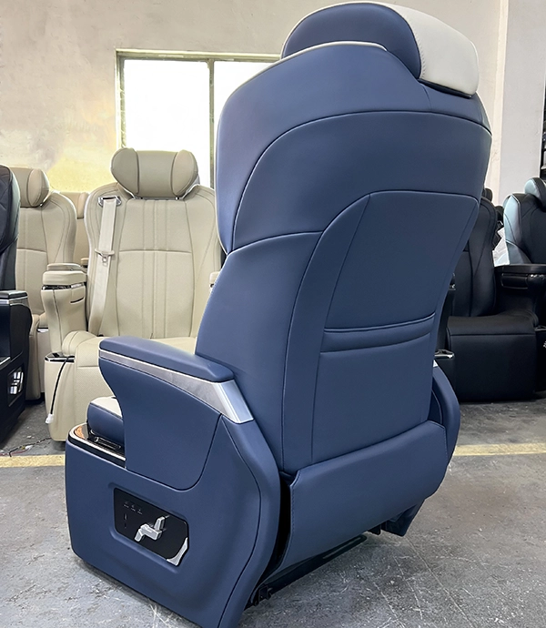 Rear view of a luxury blue captain seat in car showing backrest design