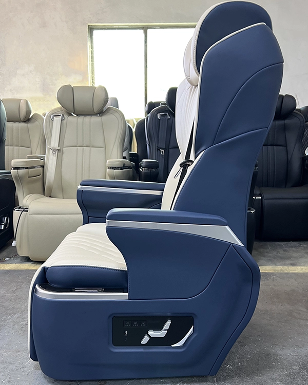 Side view of a luxury captain seat in car showing physical control buttons