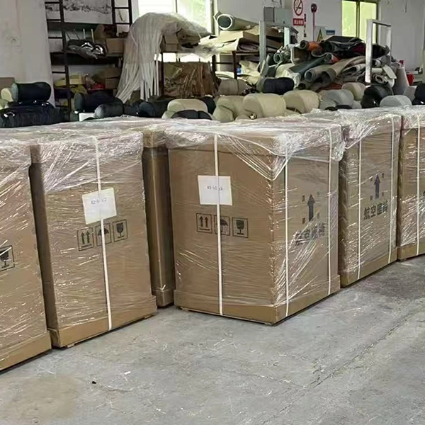Thick corrugated cardboard packaging for auto aviation seats, wrapped with stretch film and printed shipping handling symbols