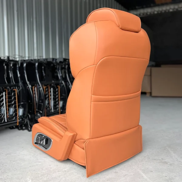 Back view of a premium leather driver and passenger seat showing the smooth finish and side control panel.