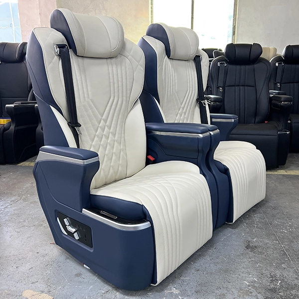 Side view of two luxury captain seat in car units in a professional workshop