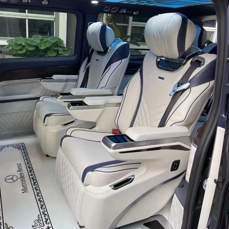 Interior view of a Mercedes-Benz Sprinter van featuring installed luxury captain seats with premium upholstery and ergonomic design.