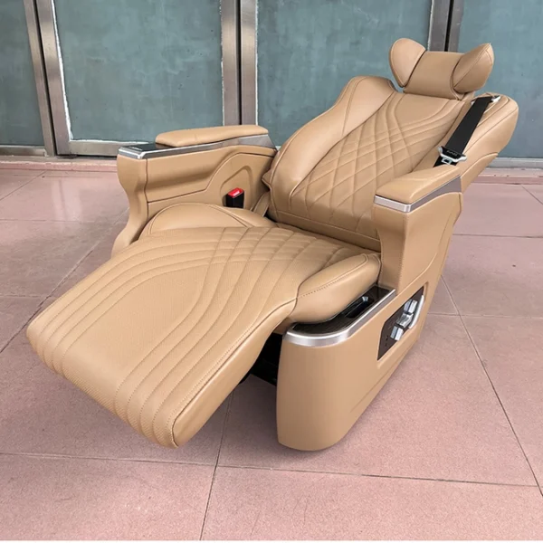 A Kia Carnival captain seat fully reclined to 160 degrees, showing the electric footrest and premium leather comfort.