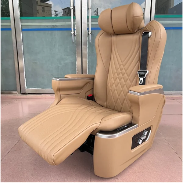 A premium Kia Carnival captain seat with the electric leg rest extended, designed for ergonomic support and luxury travel.