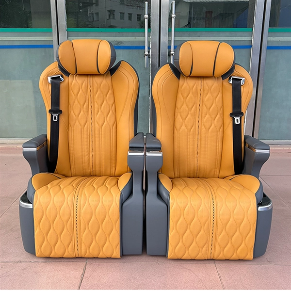 A pair of luxury auto seats in orange and grey, featuring customizable leather colors and intricate diamond stitching patterns for van interior upgrades.