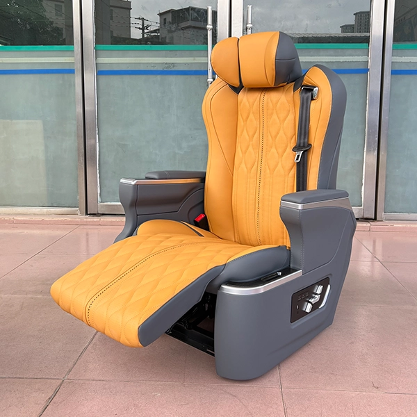 Orange and grey luxury auto seats featuring an extended electric leg rest for enhanced leg support.