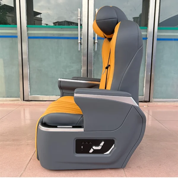 Side view of luxury auto seats showing the new physical button controller for electric adjustment of backrest, leg rest, and seating position.