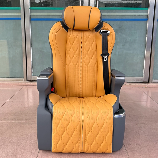 Front view of luxury auto seats featuring a stylish orange and grey two-tone leather finish with diamond stitching.