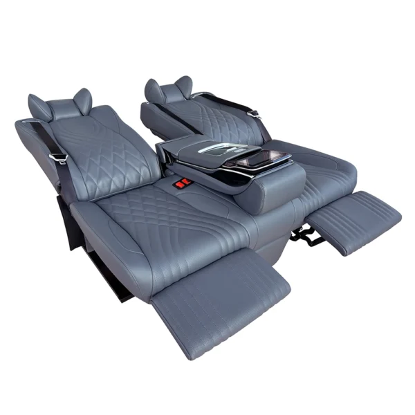 Gray leather luxury car back seat showing fully flat recline mode with extended electric leg rest