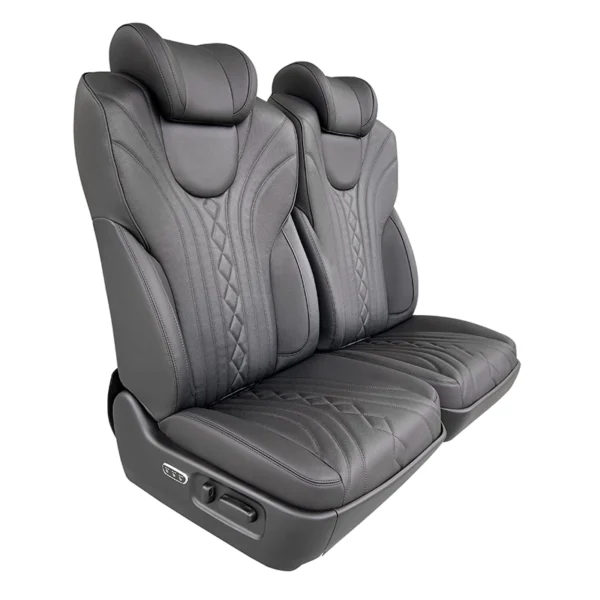 Side view of a luxury driver passenger seat featuring electric control buttons for seat adjustment.