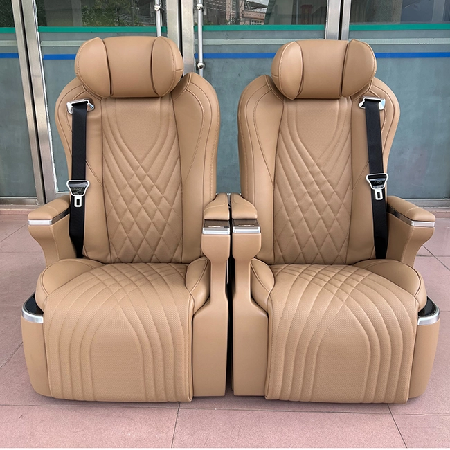 A pair of luxury Kia Carnival captain seats in a sophisticated tan leather finish, showcasing a grand and elegant front design.