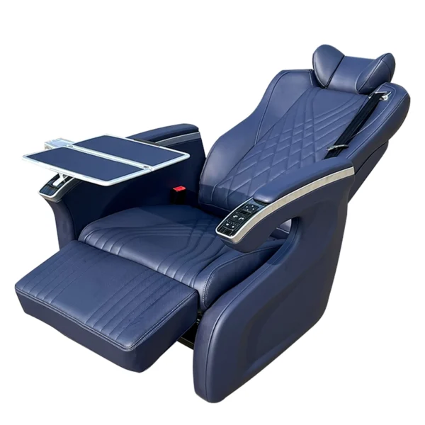 Comprehensive side view of luxury seats featuring an extended electric leg rest, reclined backrest, and an open metal folding table.