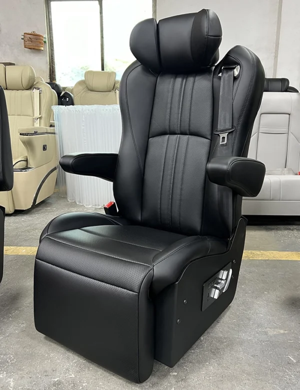 Factory angled shot of black leather luxury van captain seat, vertical perforated stitching, flexible movable armrest, side physical control buttons, fully customizable upholstery colors