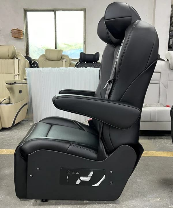 Side view of black luxury van seats featuring an upgraded physical button control panel and ergonomic armrest