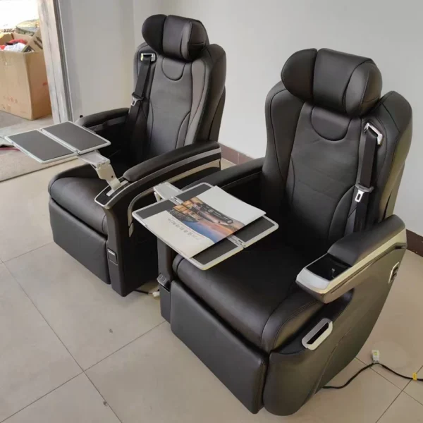 Side view of luxury Mercedes Vito van seats featuring 360-degree rotation and an adjustable folding tray table for office use.