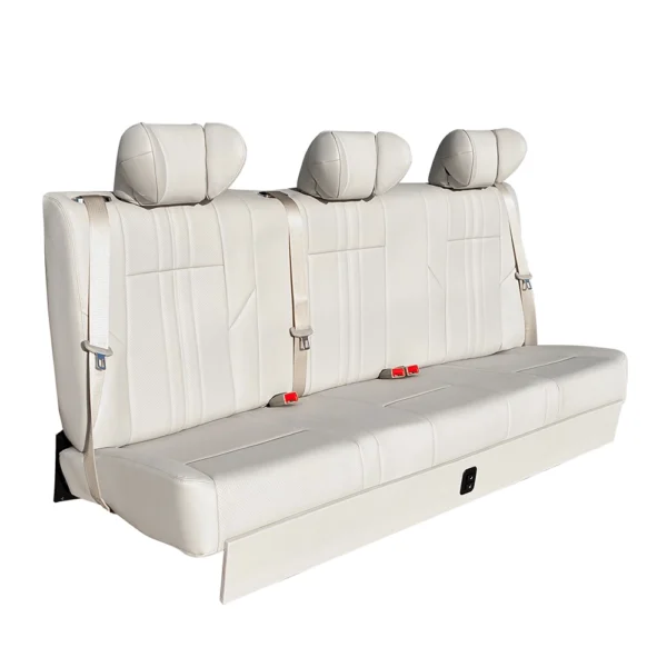 Side view of a white leather three-passenger car rear seat with three headrests and safety belts