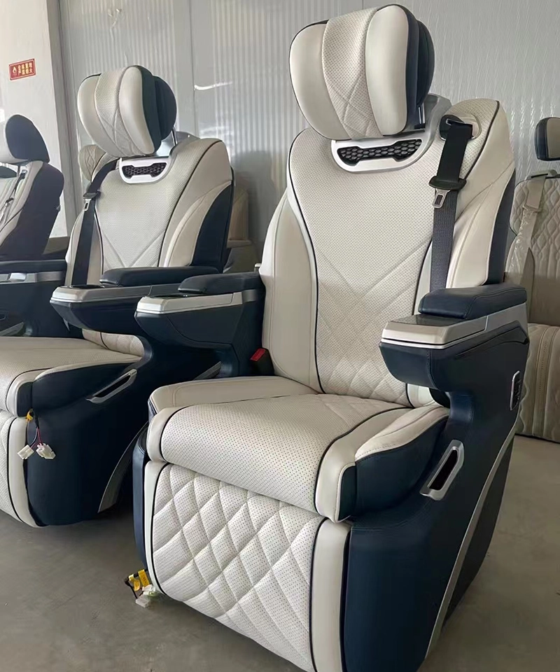 Side view of luxury Sprinter captain seats featuring new headrest design, side wireless charging, and 360-degree swivel functionality.