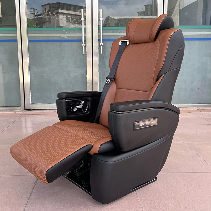 Close-up of a Toyota Hiace van seat with the electric leg rest raised for ergonomic leg support.