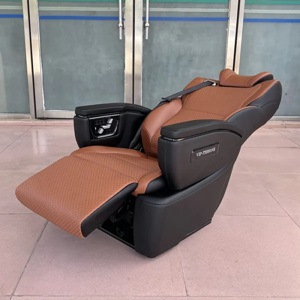 Toyota Hiace van seats in a fully reclined position with the electric leg rest extended for maximum comfort.