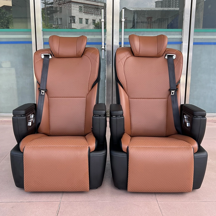 A pair of luxury Toyota Hiace van seats with a modern brown and black leather design.