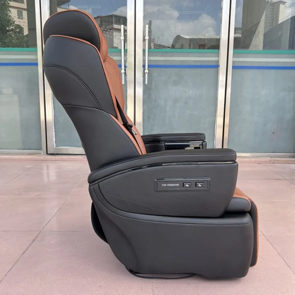Side profile of Toyota Hiace van seats showing control buttons and premium leather finish.