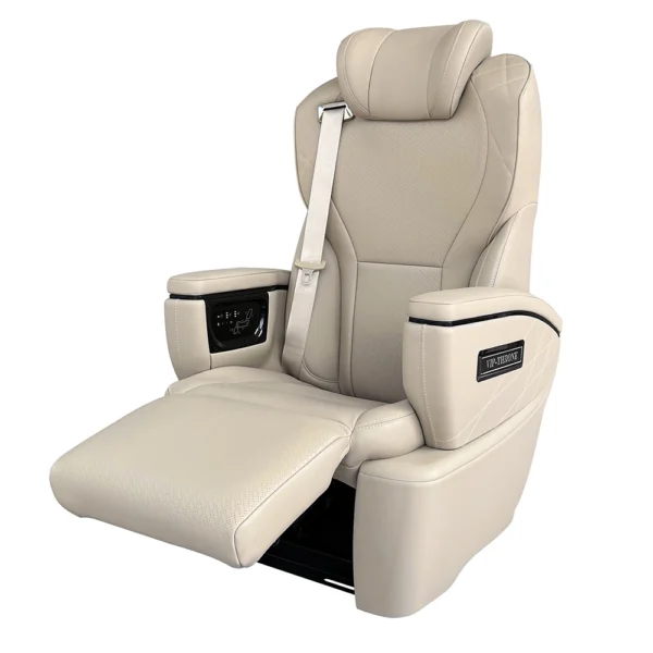 Side shot of leather van luxury seats showing unfolded leg rest and touch screen controller