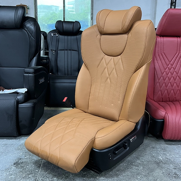 A premium car passenger seat featuring an adjustable electric leg rest and diamond-stitched leather, ideal for luxury MPV and van interior upgrades.