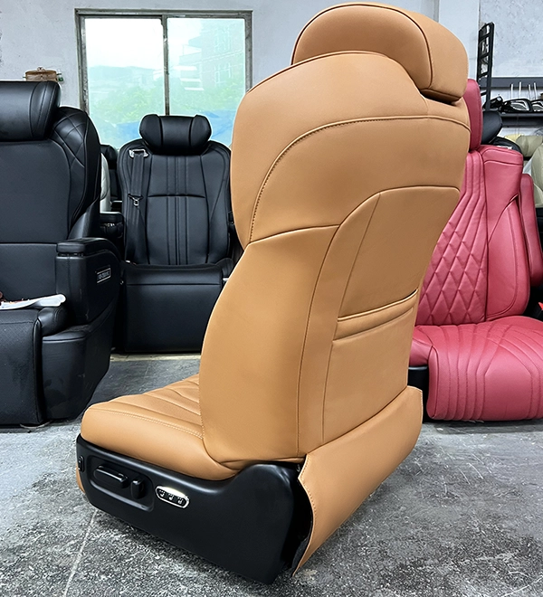 Side and back view of a high-end luxury car passenger seat, highlighting the sleek backrest design and premium leather finish.