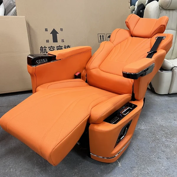 Orange captain seat van in fully reclined position